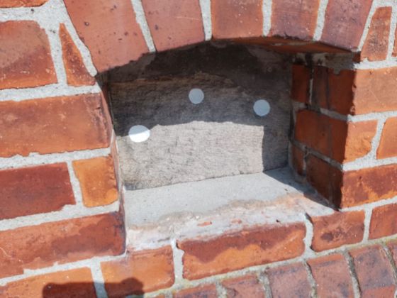 Bronze age stone in Vor Frue church, Svendborg (Cup Marked Stone)